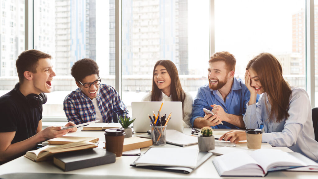 Education concept. Happy friends with books and laptop - Christian Counselors of Mooresville Study groups can help you learn and be fun.