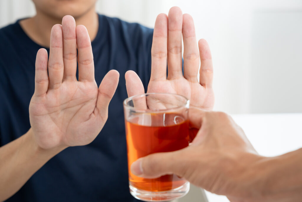man refuses say no and avoid to drink an alcohol whiskey , stopping hand sign male, alcoholism treatment, alcohol addiction, quit booze, Stop Drinking Alcohol. Refuse Glass liquor, unhealthy, reject - Christian Counselors of Mooresville Protect yourself. It is healthy to say "No" to alcohol, especially if someone else mixed the drink.