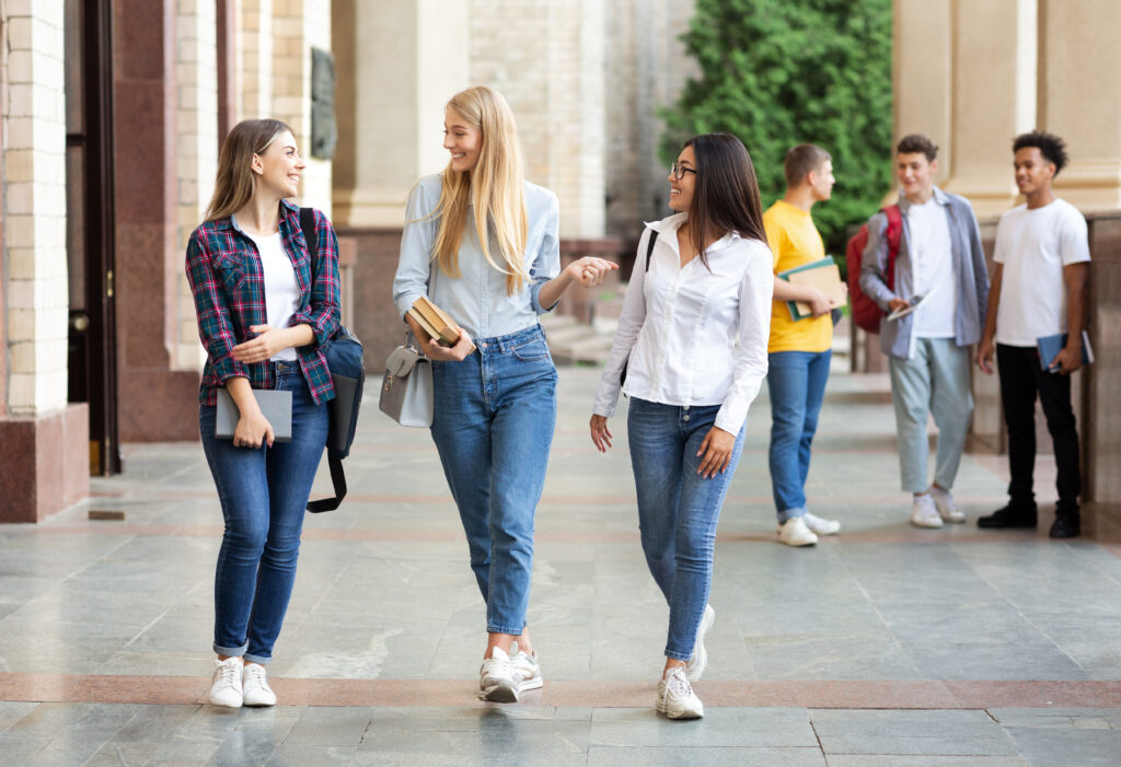University life. Girls walking after classes outdoors - Christian Counselors of Mooresville Be safe by walking in groups on campus, especially at night.